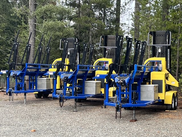 Rental fleet of DYNA processors lined up with their conveyors folded for towing
